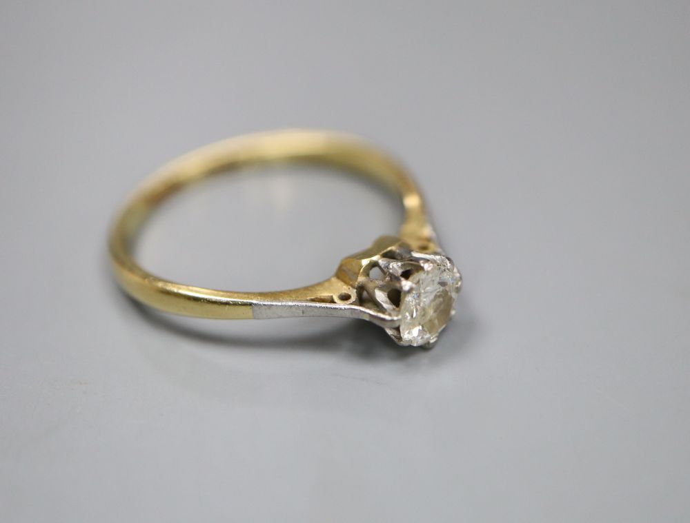 An 18ct and solitaire diamond ring, size O, gross 2.3 grams,